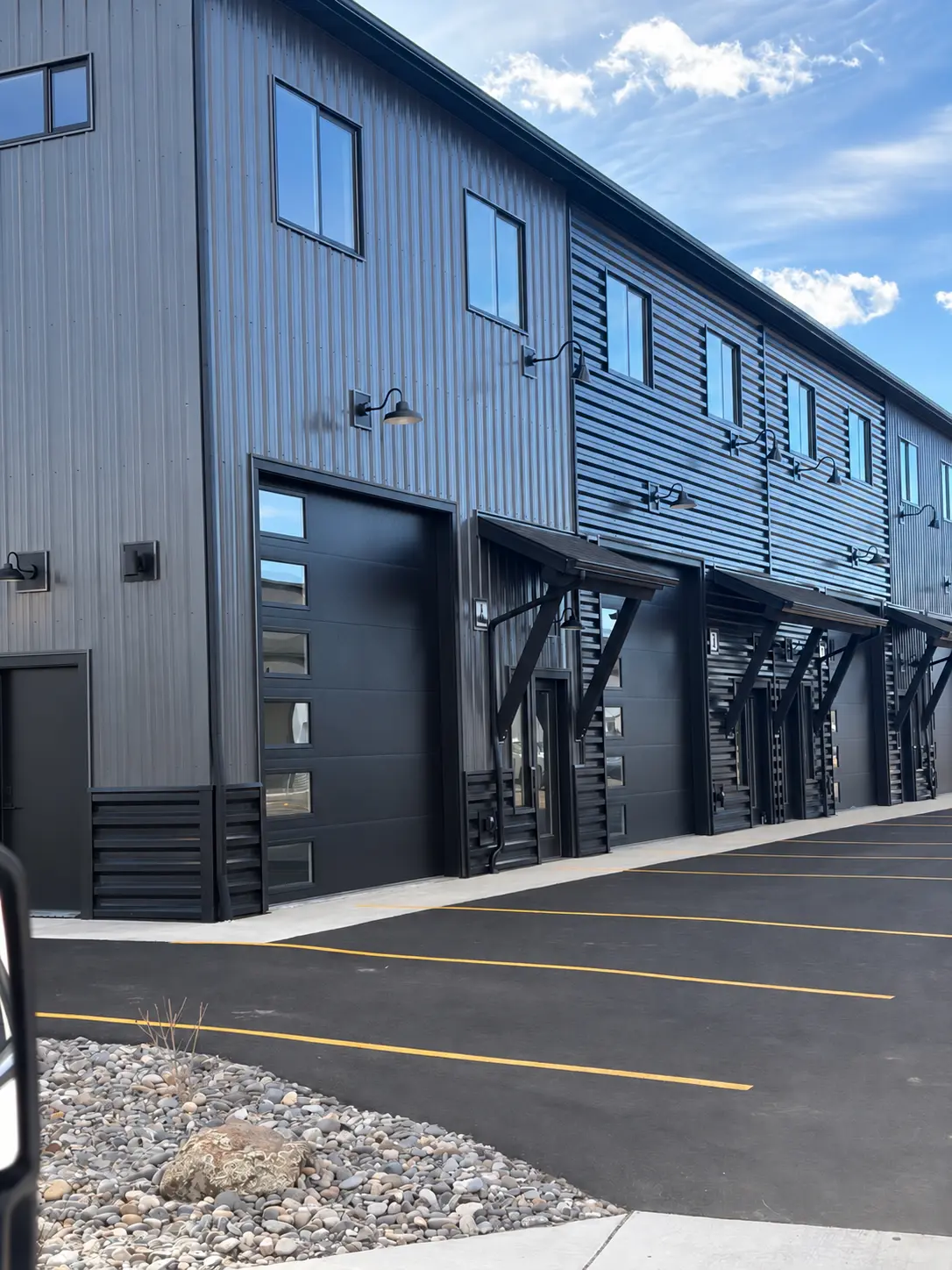 Finished commercial metal building with overhead doors and architectural wall panels
